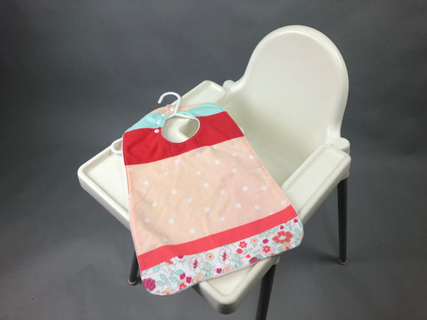 Super bibs! Wider and longer with an adustable neck opening for the perfect fit - Pinks