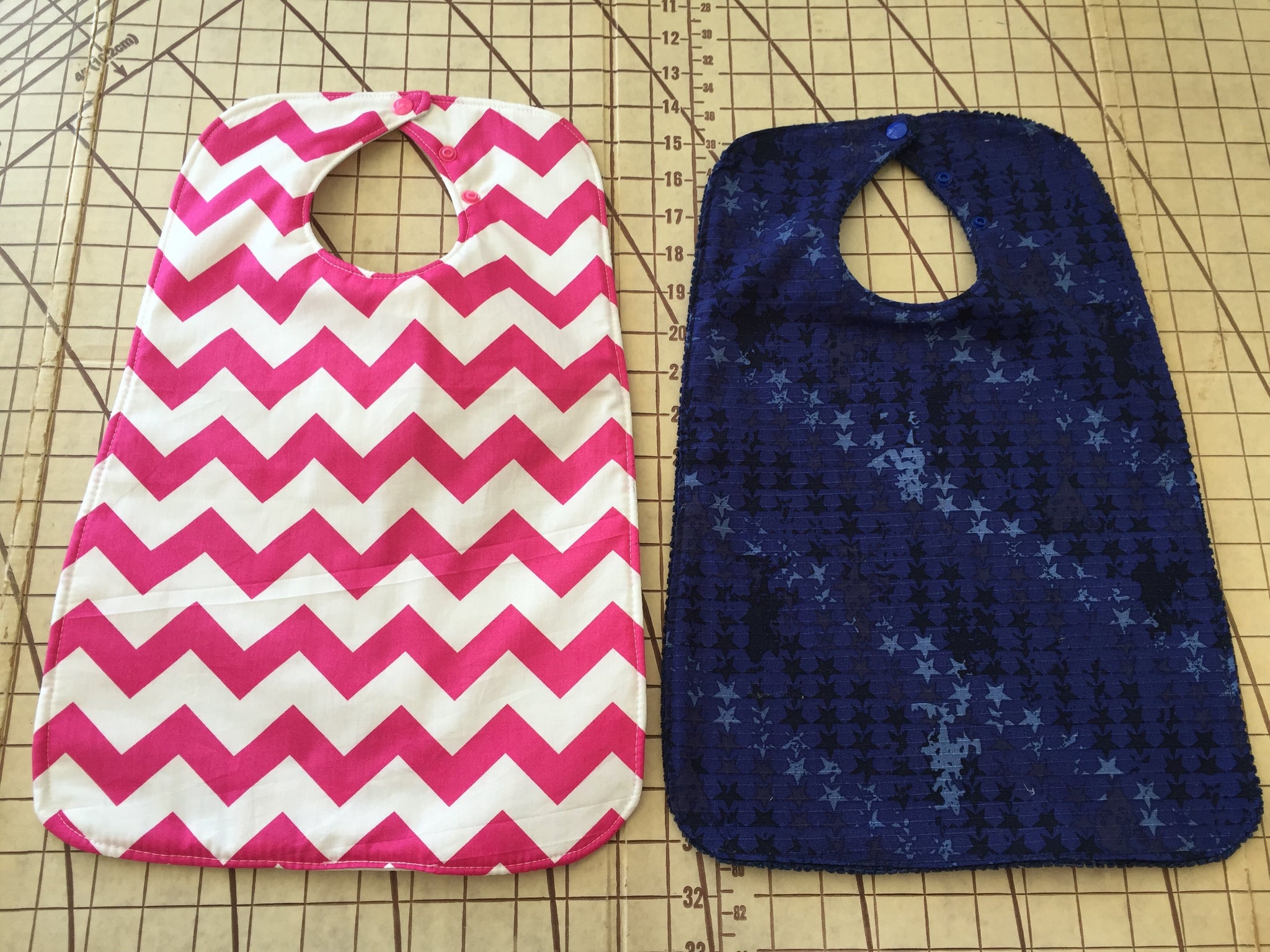 Super bibs! Wider and longer with an adustable neck opening for the perfect fit